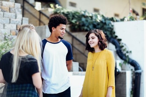 Teens talking outside